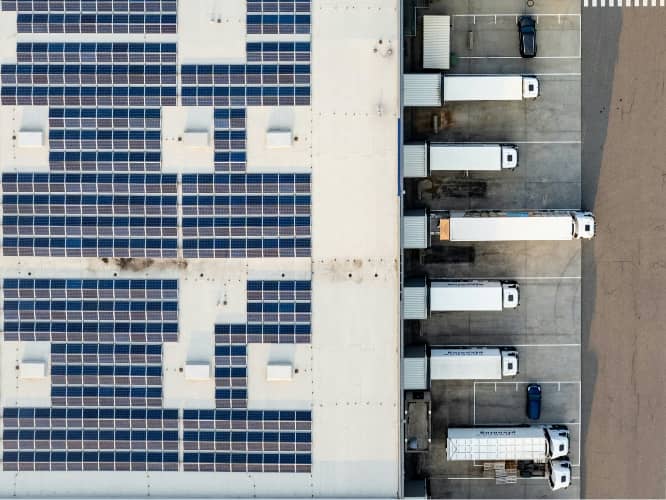 top view of warehouse with tractor trailers at the dock doors